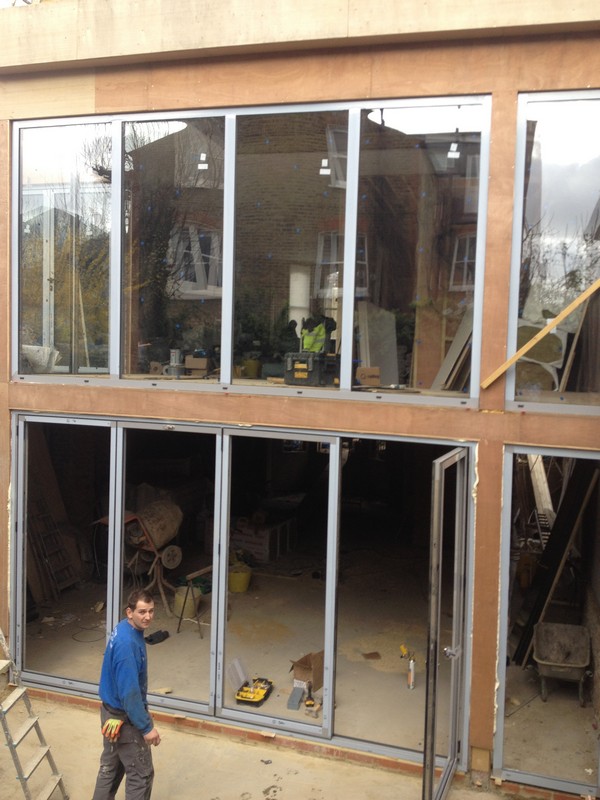 Aluminium bi-fold doors with two-storey glazing in Whitechapel
