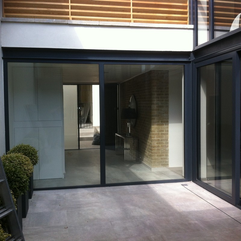 Floor-to-ceiling sliding doors opening to courtyard in Whitechapel