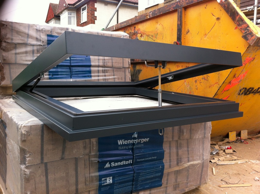 Opening flat roof skylight in anthracite grey installed in Whitechapel